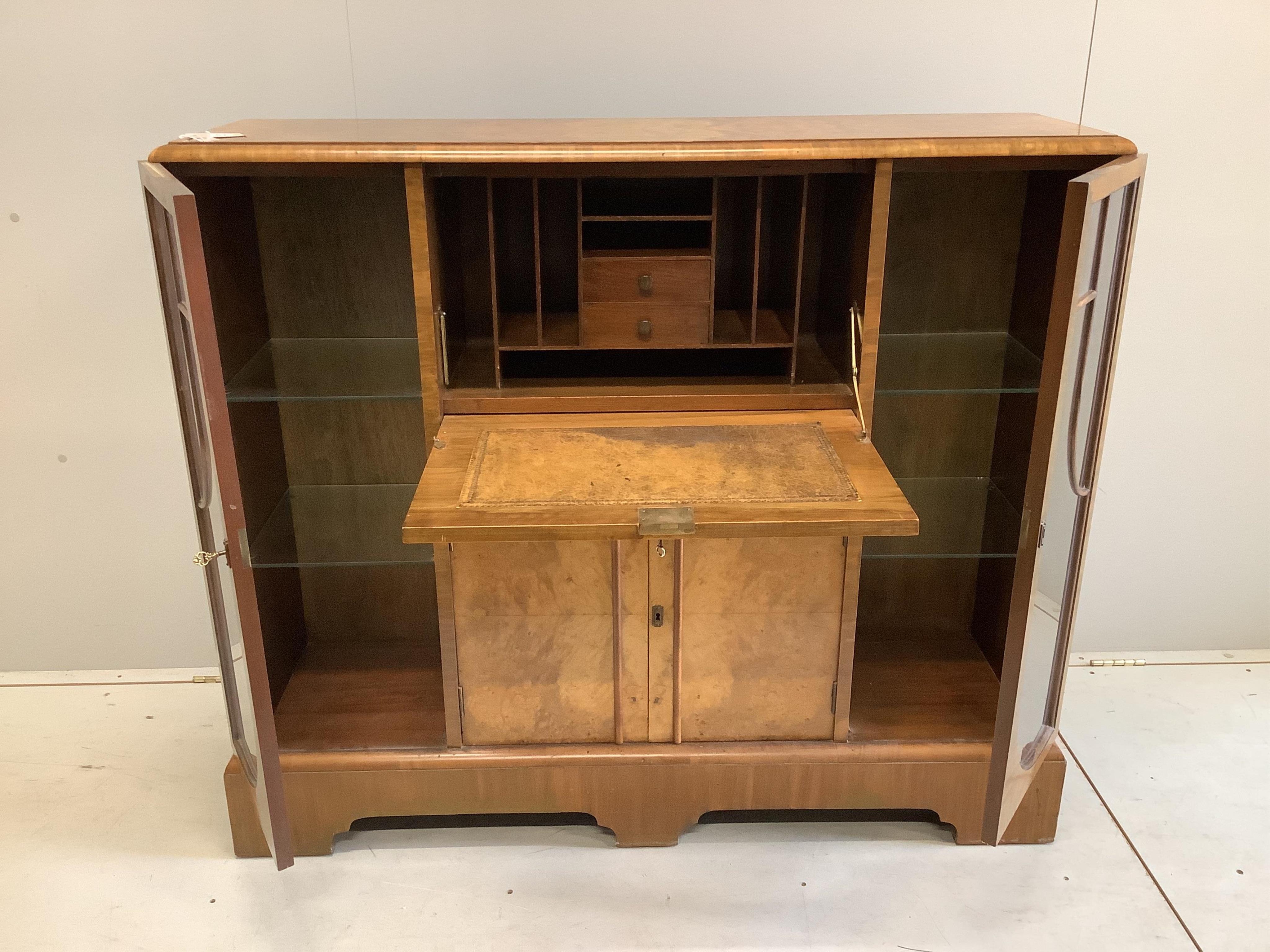 An early 20th century Art Deco style burr walnut secretaire cabinet, width 122cm, depth 34cm, height 107cm. Condition - fair to good.